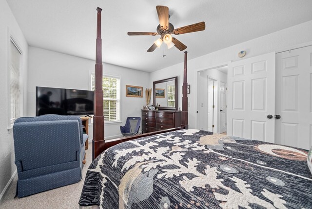 carpeted bedroom with ceiling fan