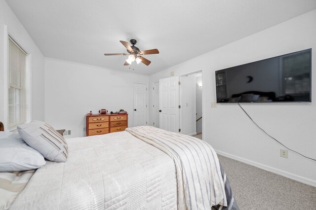 bedroom with ceiling fan and carpet flooring