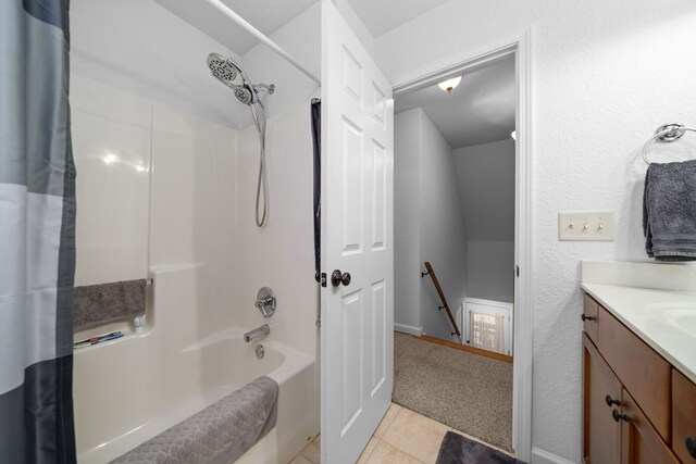 bathroom featuring shower / bath combo, tile patterned flooring, and vanity