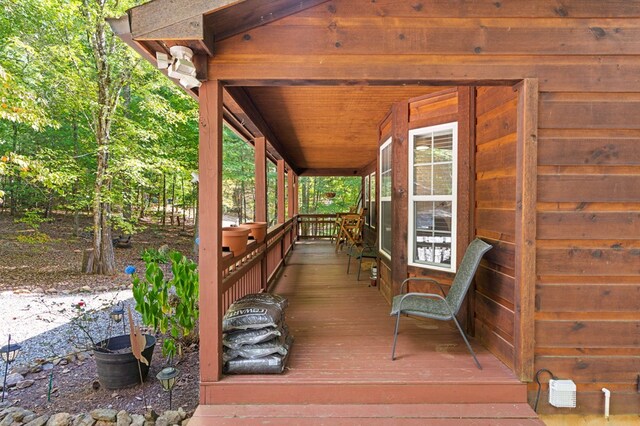 wooden terrace featuring a porch