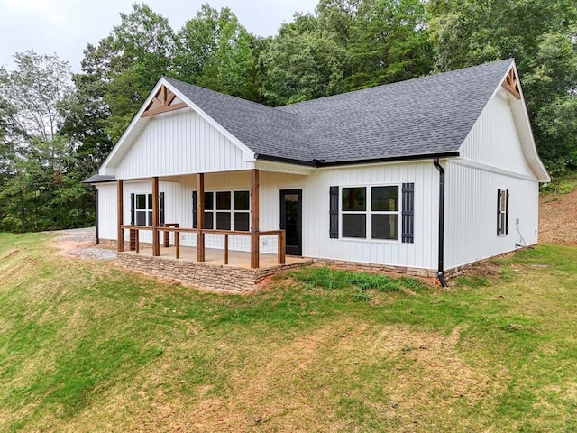 rear view of house with a yard