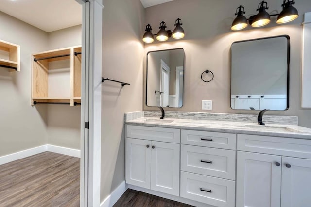 bathroom with vanity and hardwood / wood-style floors