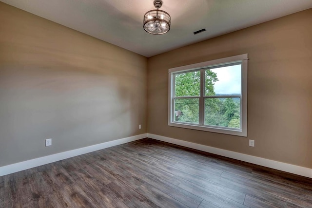 spare room featuring hardwood / wood-style floors