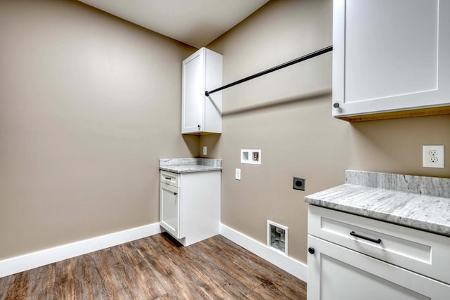 washroom with cabinets, hookup for a washing machine, dark wood-type flooring, and hookup for an electric dryer