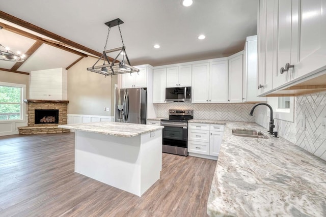 kitchen featuring white cabinetry, stainless steel appliances, and sink