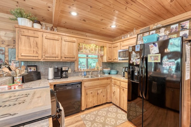 kitchen with light brown cabinetry, sink, and black appliances