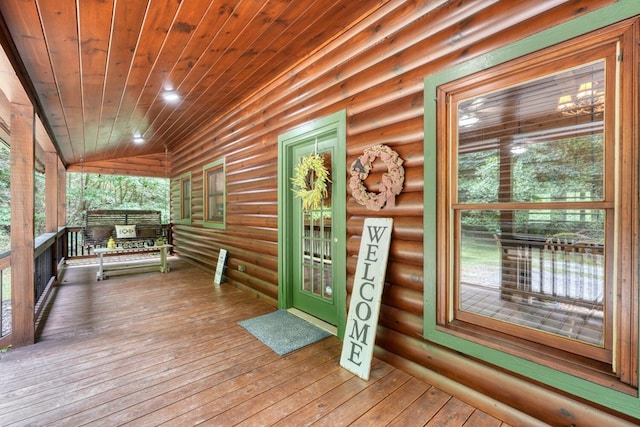 wooden terrace featuring a porch