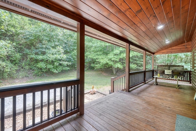 wooden terrace with a grill