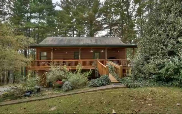 rear view of property with a deck