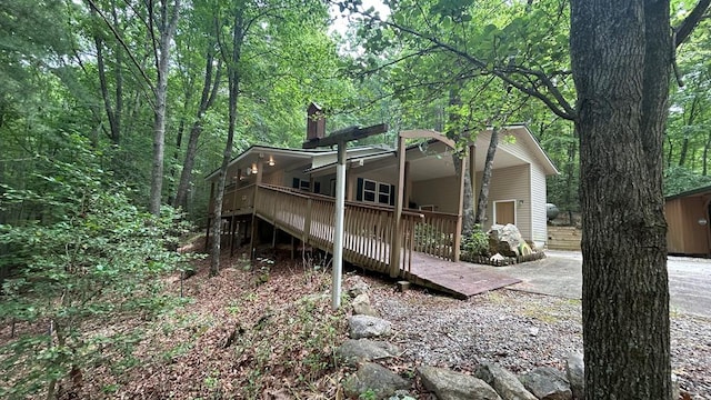 143 Sorghum Mill Run, Blairsville, GA 30512 - rear view of property featuring covered porch and a forest view