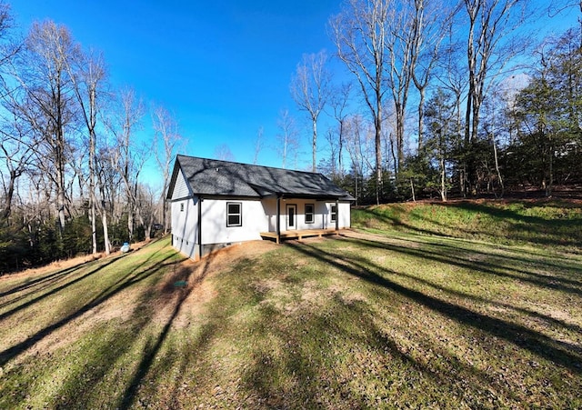 view of side of property featuring a yard