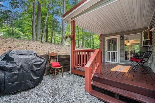 wooden deck with area for grilling