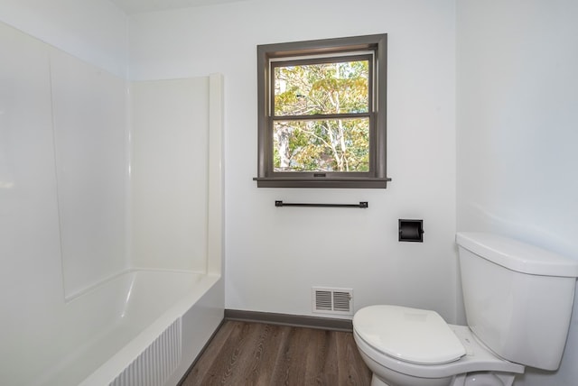 bathroom featuring toilet and wood-type flooring