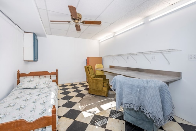 bedroom with a paneled ceiling and ceiling fan