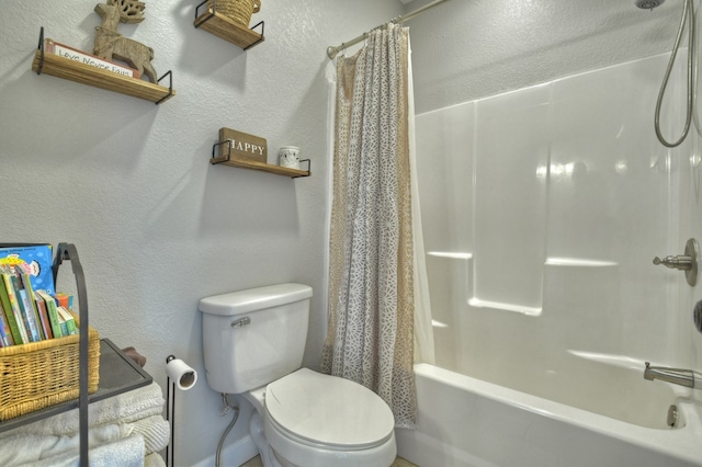 bathroom with a textured wall and toilet