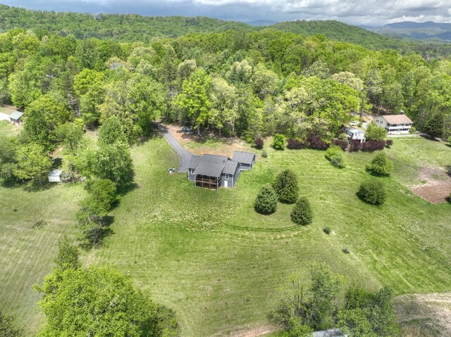 bird's eye view featuring a forest view