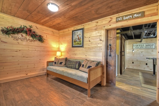 living area featuring wooden ceiling, dark wood finished floors, and wood walls