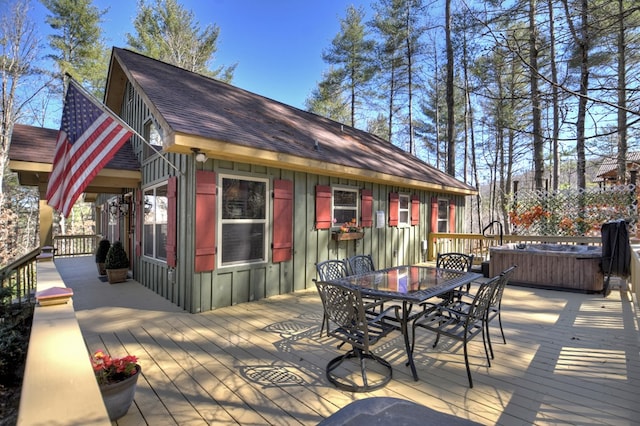 wooden terrace featuring outdoor dining area