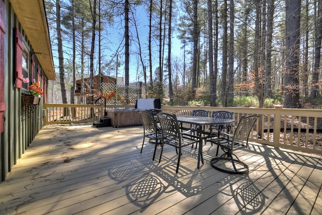 wooden deck featuring outdoor dining space