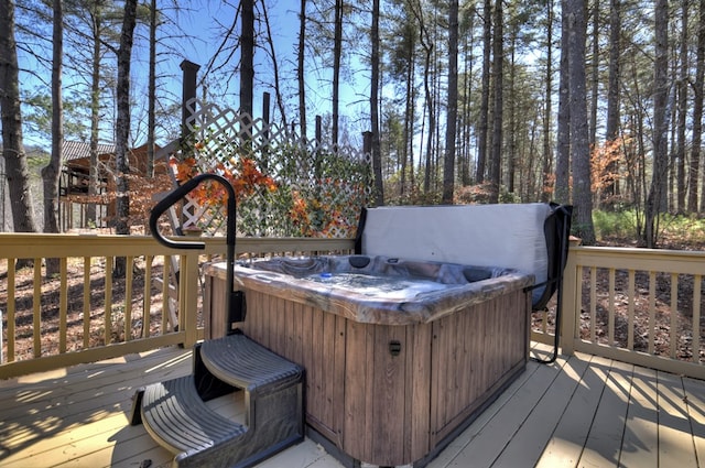 deck featuring a hot tub