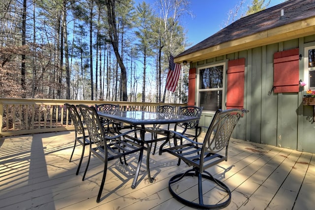 wooden terrace featuring outdoor dining space