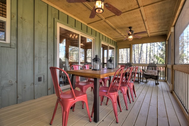 sunroom with wooden ceiling and ceiling fan