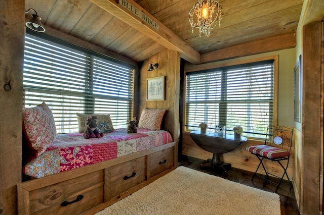 bedroom with a chandelier, beamed ceiling, and wooden ceiling