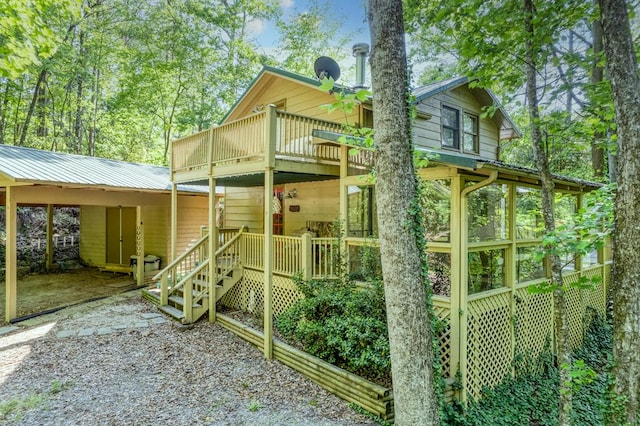 50 Rustic Rdg, Blue Ridge, GA 30513 - view of front of property featuring driveway, metal roof, an attached carport, and a sunroom
