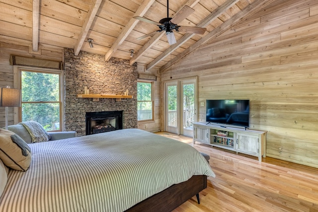 50 Rustic Rdg, Blue Ridge, GA 30513 - bedroom with wooden ceiling with exposed beams, wooden walls, access to exterior, wood finished floors, and a fireplace