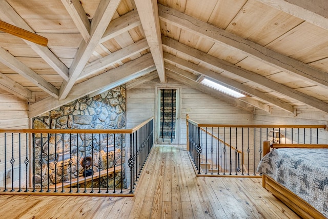 50 Rustic Rdg, Blue Ridge, GA 30513 - unfurnished bedroom with wooden walls, a skylight, wood ceiling, and hardwood / wood-style flooring