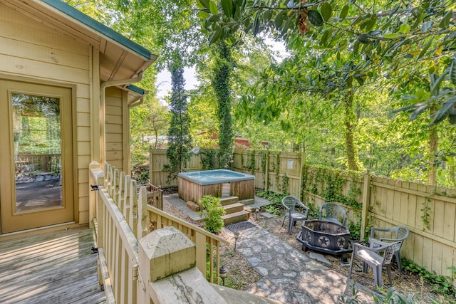 50 Rustic Rdg, Blue Ridge, GA 30513 - wooden terrace featuring a hot tub, an outdoor fire pit, and a fenced backyard