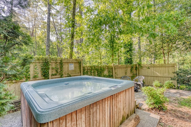 50 Rustic Rdg, Blue Ridge, GA 30513 - view of swimming pool featuring a hot tub, a fenced backyard, and view of wooded area