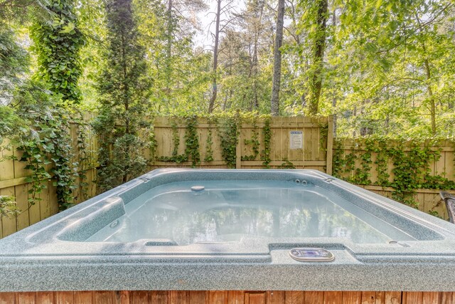 50 Rustic Rdg, Blue Ridge, GA 30513 - view of swimming pool with a hot tub and a fenced backyard