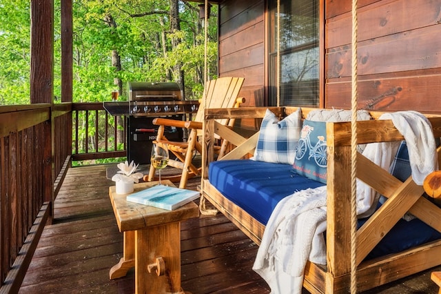 wooden terrace featuring a grill