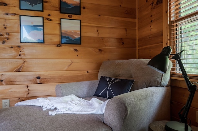 bedroom with wood walls