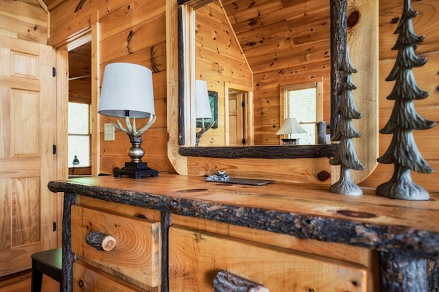 bathroom featuring vaulted ceiling, vanity, wood ceiling, and wood walls