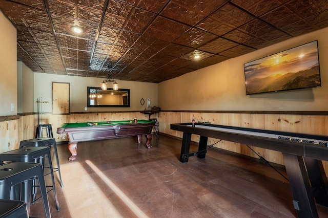 recreation room with hardwood / wood-style floors, pool table, and wooden walls