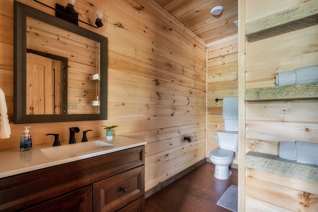 bathroom with toilet, concrete flooring, wood ceiling, vanity, and wooden walls