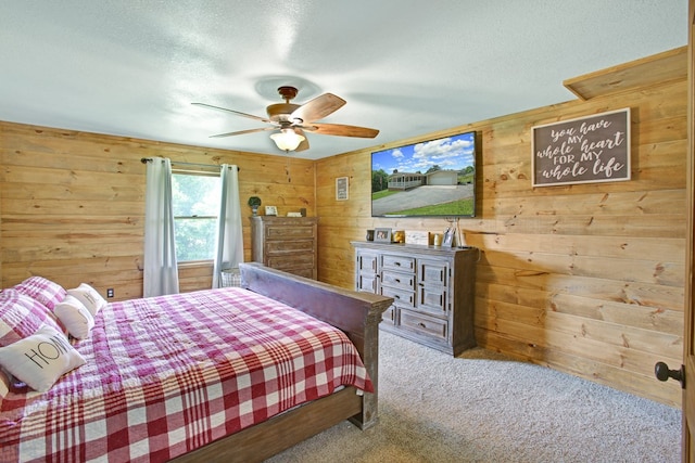 bedroom with carpet floors and wooden walls