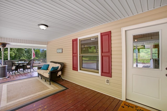 deck with outdoor dining area