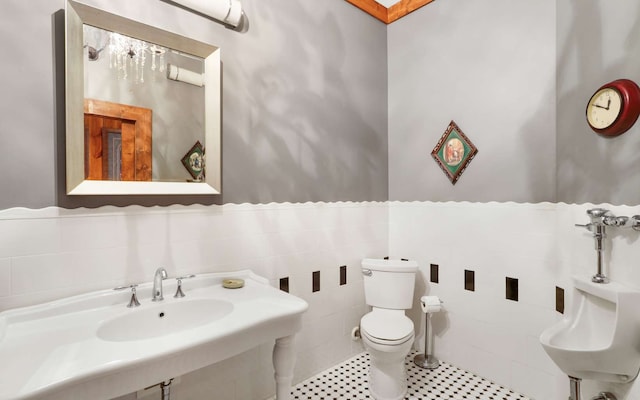 bathroom featuring tile flooring, tile walls, toilet, and tasteful backsplash