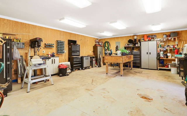 garage with wood walls and a workshop area