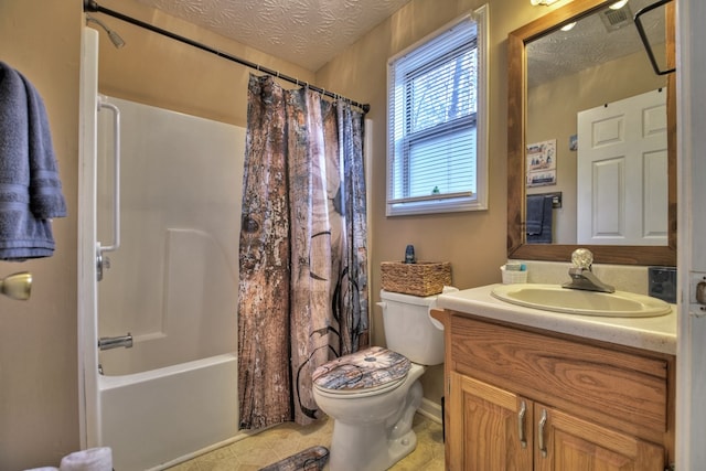 full bathroom featuring vanity, a textured ceiling, toilet, and shower / bath combo with shower curtain