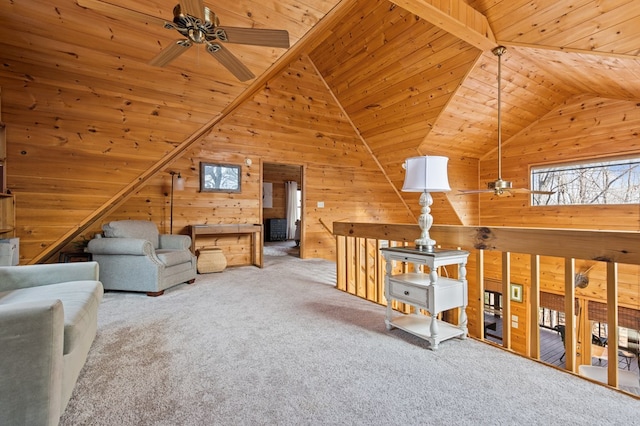 living room featuring carpet flooring, lofted ceiling, wooden ceiling, and a ceiling fan