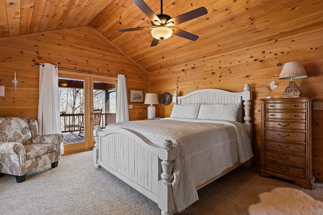 carpeted bedroom featuring vaulted ceiling, wood ceiling, wooden walls, and access to outside