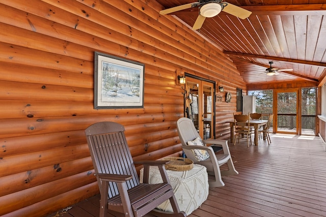 sunroom featuring wood ceiling, ceiling fan, and vaulted ceiling