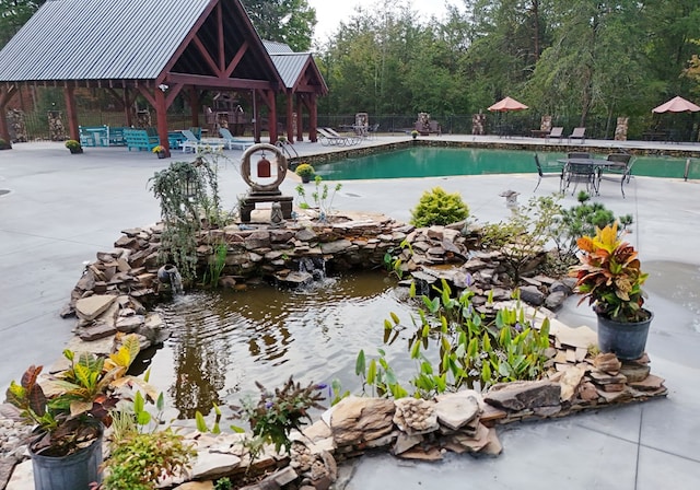 view of swimming pool with a gazebo