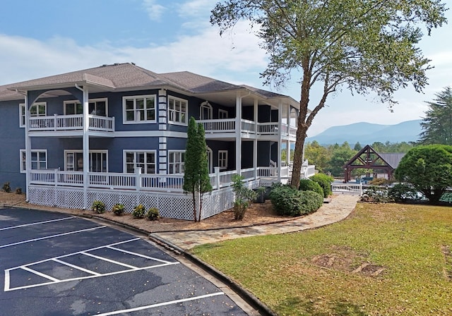 exterior space with a mountain view and a yard