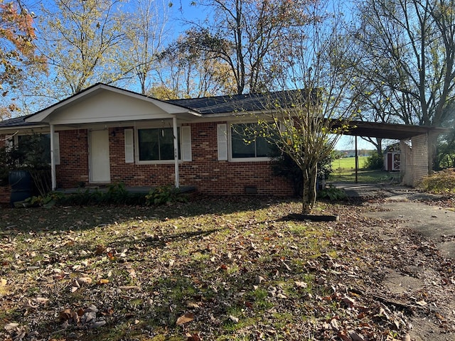 view of front facade with a carport