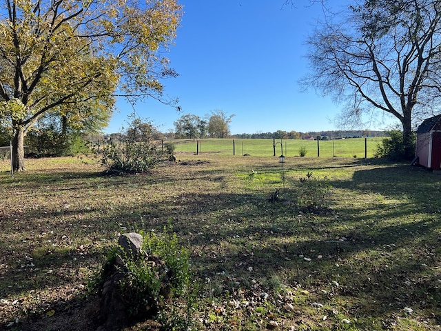 view of yard with a rural view